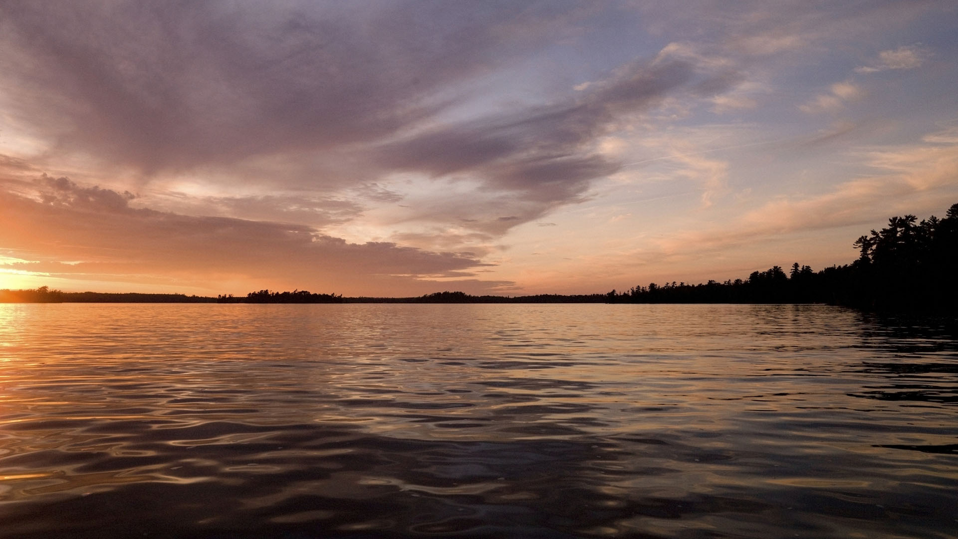 Lake of the Woods, Ontario, Canada; Twilight over still lake water
